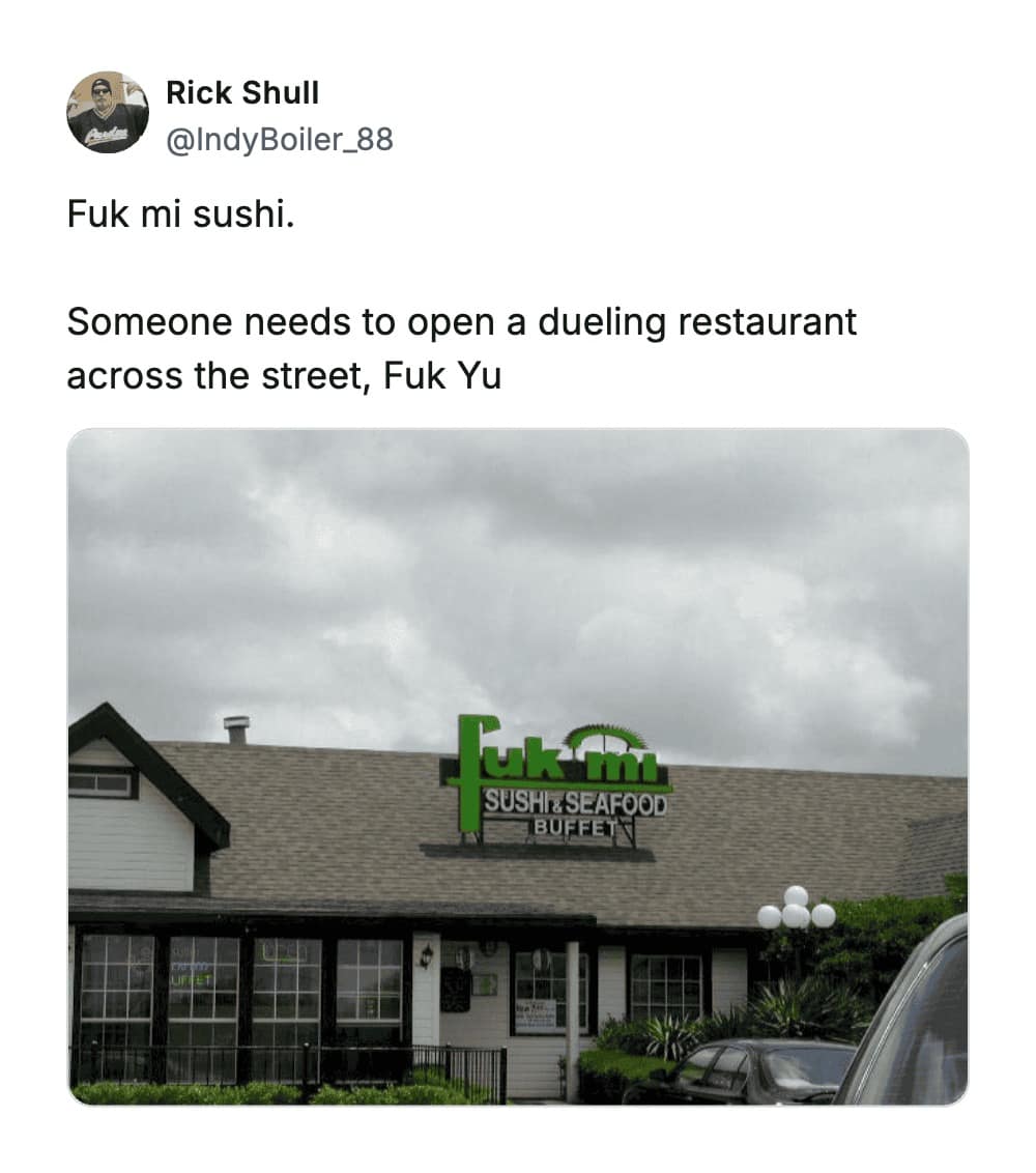 A rooftop sign for "Fuk mi SUSHI & SEAFOOD BUFFET," an aggressive and pun-heavy entry on the list of the worst business names that forces customers to say an expletive to recommend it.