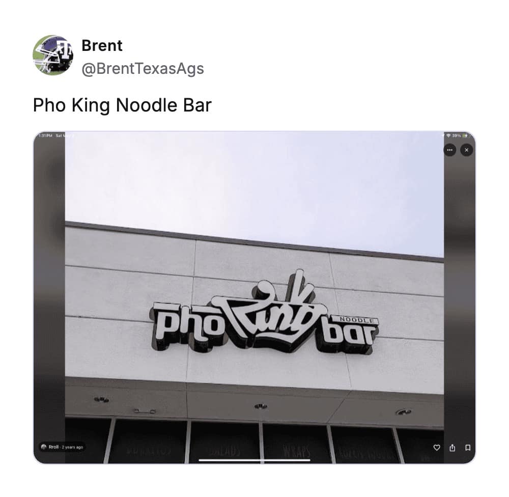 A stylized black-and-white sign for "Pho King Noodle Bar," utilizing a common but effective phonetic play on the Vietnamese dish to create one of the worst business names in the restaurant industry.
