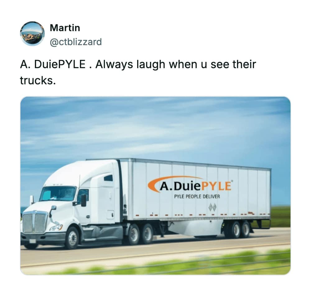A massive semi-truck hauling a trailer with the branding "A. DuiePYLE," a logistics company that frequently lands on lists of the worst business names because of how its name sounds when read aloud.