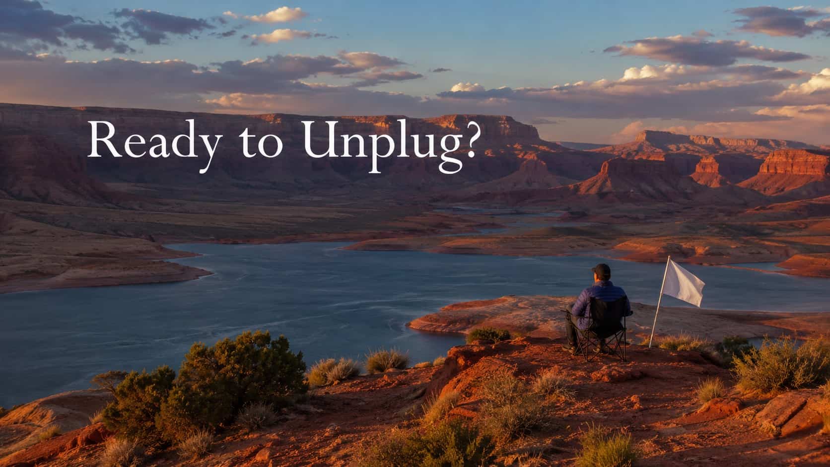 Man sitting on a cliff overlooking a canyon river with Ready to Unplug demotivational memes text.