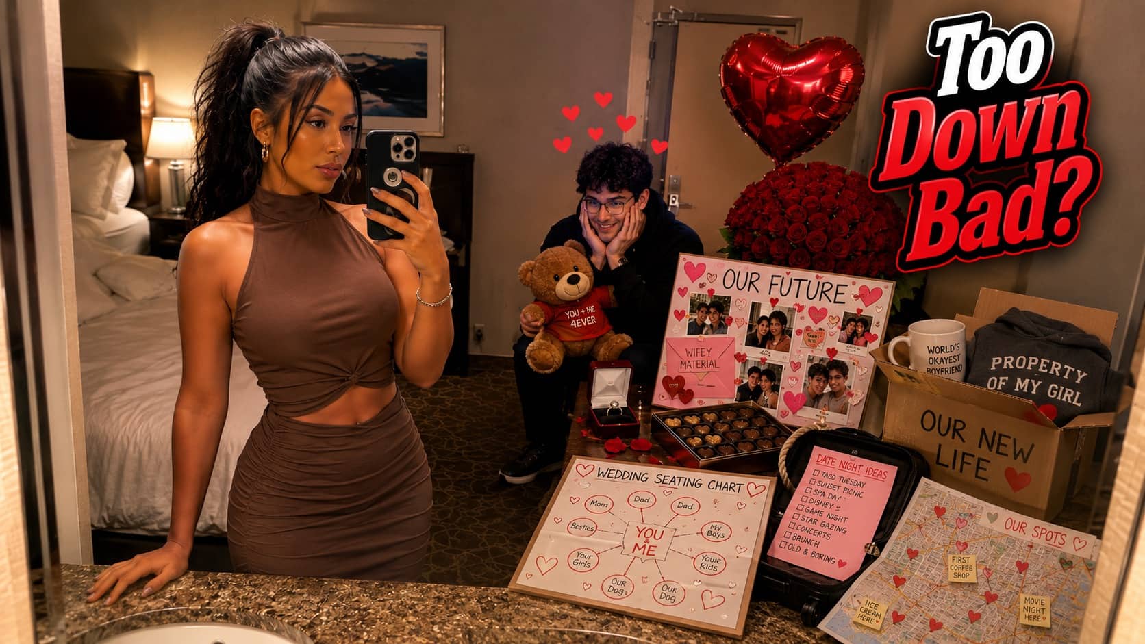 A woman taking a mirror selfie while a man stands behind her surrounded by romantic gifts.