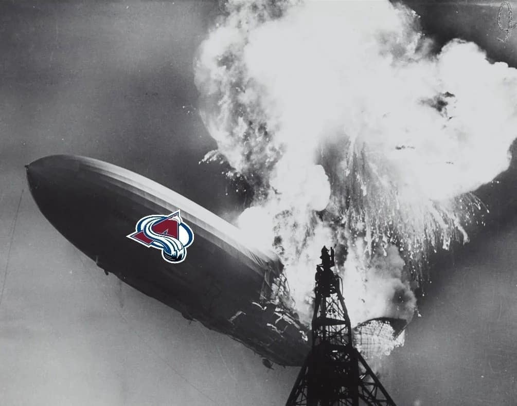 A historical photo of the Hindenburg airship disaster serving as a tragic 2026 Stanley Cup Finals meme photoshops the Colorado Avalanche logo onto the side of the exploding blimp to symbolize a catastrophic postseason collapse.