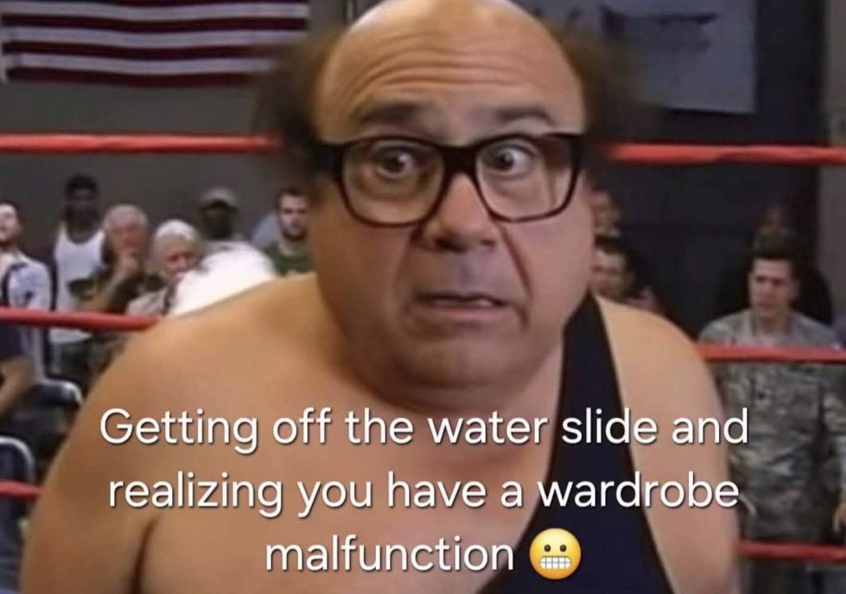 Funny meme of Danny DeVito shocked in a wrestling ring regarding a waterslide wardrobe malfunction.