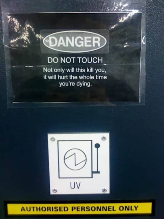 Dark humor danger sign warning that touching will hurt the whole time you are dying.