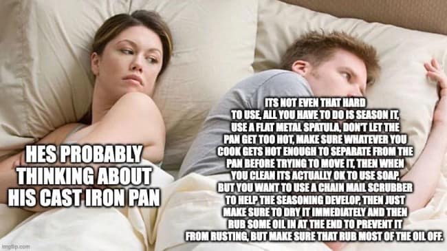 The iconic "He's probably thinking about other women" bed image macro functions as a verbose cast iron skillet meme, where the woman suspects her partner is straying, but his entire half of the frame is consumed by a massive, unhinged wall of text detailing flat metal spatulas, lipid polymerization, and chainmail scrubbers.