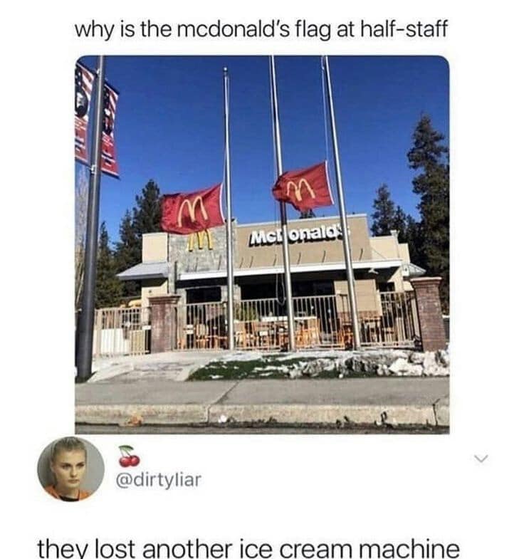 McDonald's restaurant storefront with corporate flags flying at half-staff below a hardware failure reply text screenshot classic meme.