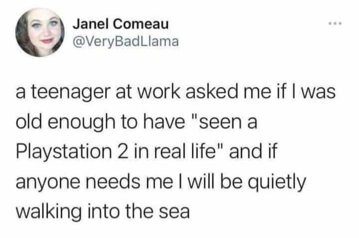 A devastating age-realization text post saved as a classic meme captures a tweet by Janel Comeau (@VeryBadLlama) detailing her absolute existential dread after a teenager at work asked if she was old enough to have seen a PlayStation 2 console in real life.