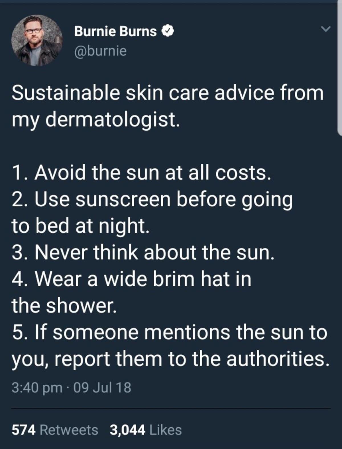 An unhinged skincare advice post operates as a classic meme, capturing a tweet by Burnie Burns listing rules from his dermatologist that include avoiding the sun at all costs, wearing a wide-brim hat in the shower, and reporting anyone who mentions daylight to the authorities.