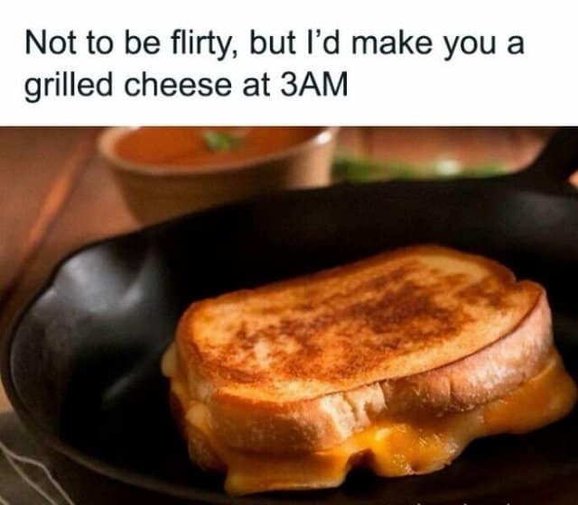 A low-stakes late-night romance layout operating as a wholesome classic meme states "Not to be flirty, but I'd make you a grilled cheese at 3AM" over a close-up photo of a perfectly toasted, golden-brown sandwich with melted cheddar cheese oozing out into a black cast-iron skillet.