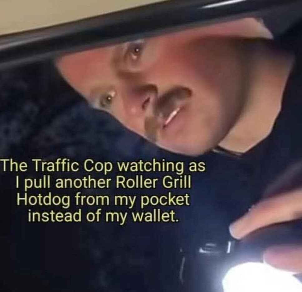 A chaotic roadside stop image macro circulating as a hilarious classic meme shows an intense traffic cop peering through a car window with a flashlight as a driver pulls a hot dog out of his pocket instead of a wallet.