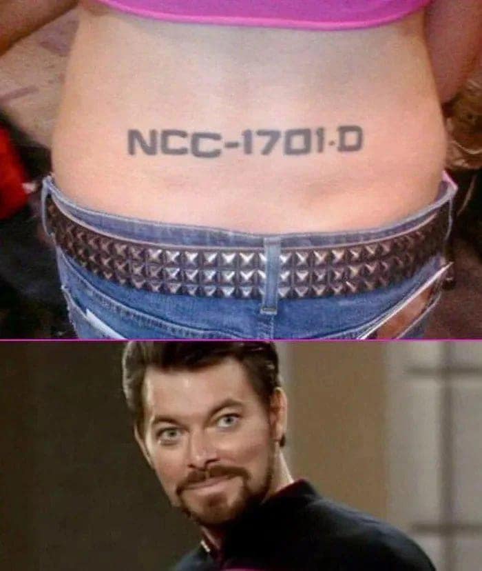 A sci-fi themed classic meme pairing a close-up photo of a lower-back tramp stamp tattoo reading "NCC-1701-D" (the Star Trek Enterprise registry number) with an intensely approving, smugly grinning reaction shot of Commander William Riker.