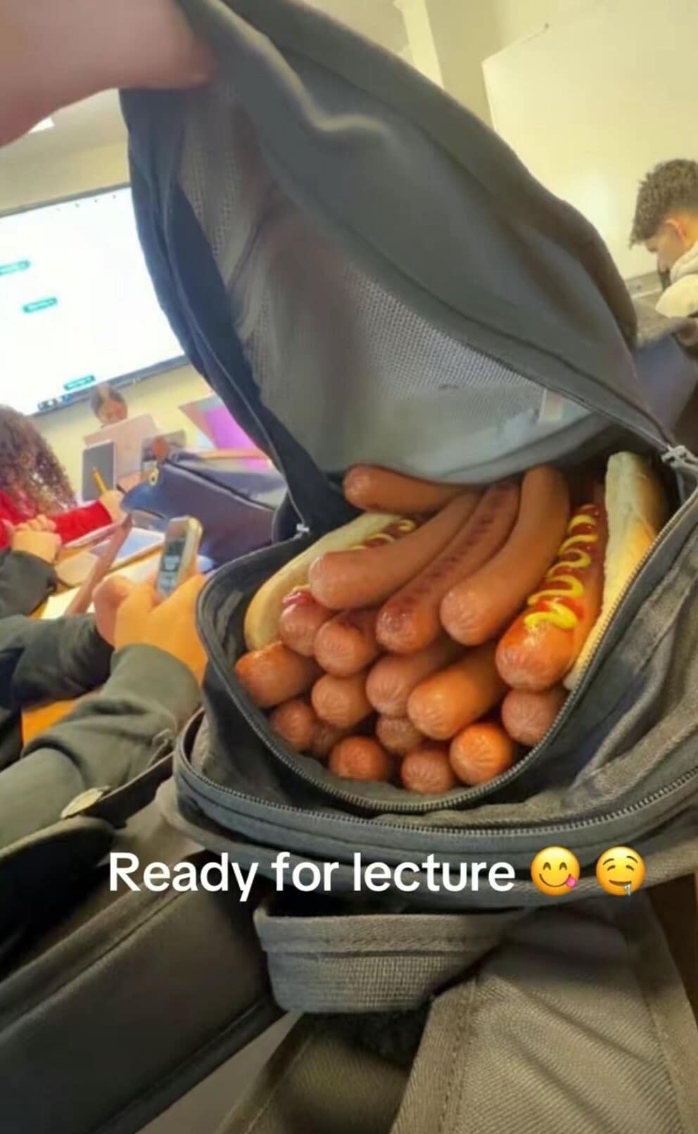 A chaotic student lifestyle snapshot found in galleries of classic memes shows a high schooler's black campus backpack unzipped to reveal it is packed to absolute structural capacity with dozens of cooked loose hot dogs sitting in buns under the text overlay, "Ready for lecture."