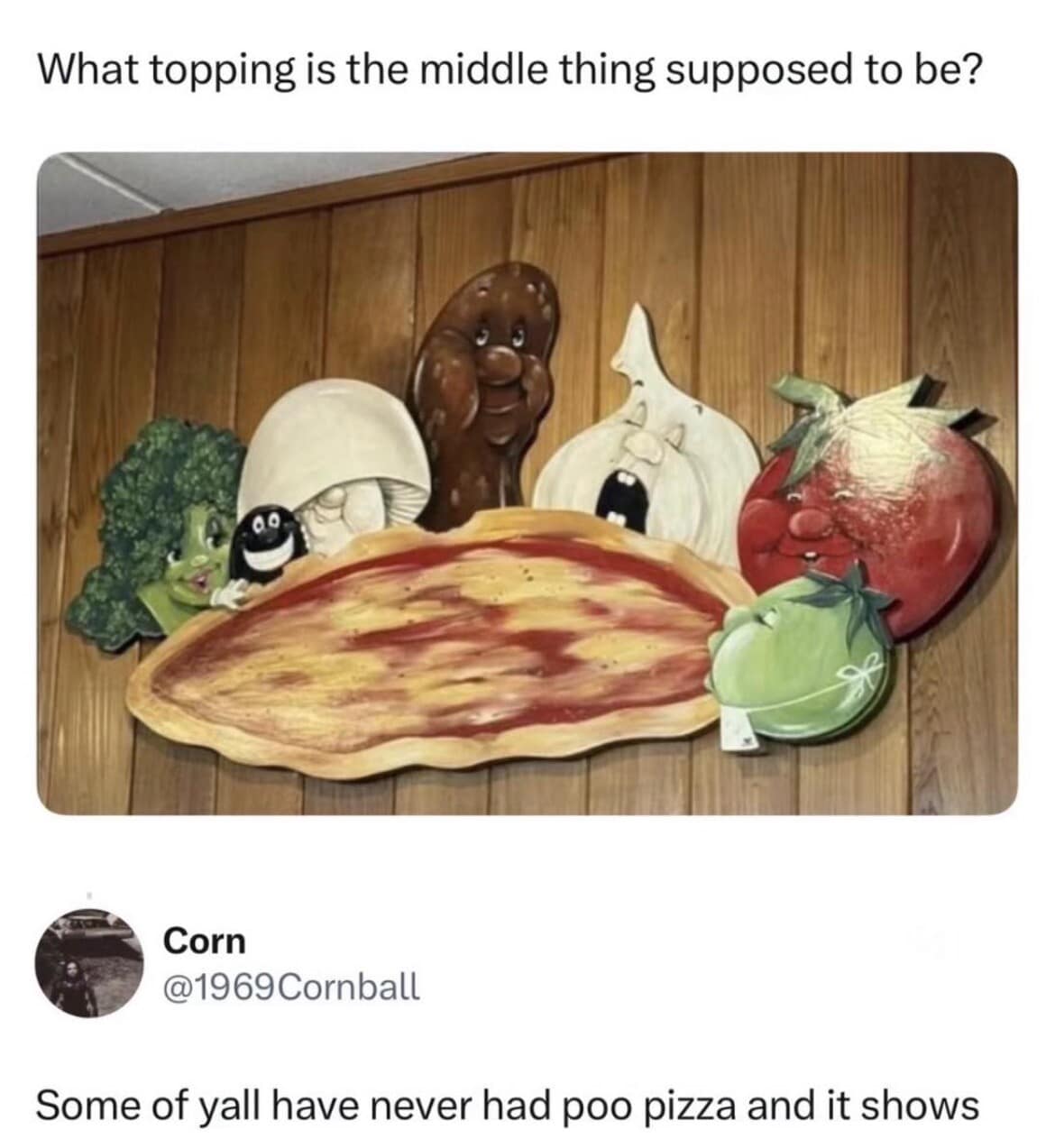 A questionable restaurant decoration photo circulating as an old meme highlights a wood-paneled wall display of cartoonish vegetable toppings, showcasing a social comment by user Corn mocking a suspicious brown lump mascot in the center as "poo pizza."