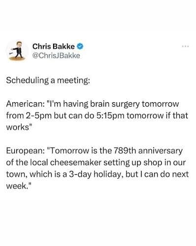 A text-based screenshot of a classic meme from X user Chris Bakke contrasting American vs European corporate meeting habits. The hyper-productive American offers a meeting slot minutes after a major brain surgery, while the relaxed European requests a week-long delay due to a three-day local cheesemaker holiday.