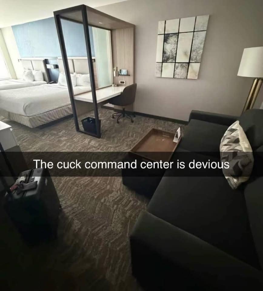 An awkward hospitality design photo circulating as a classic meme captures a hotel room layout where an armchair and workstation are positioned directly facing a sofa under the mock label, "The cuck command center."