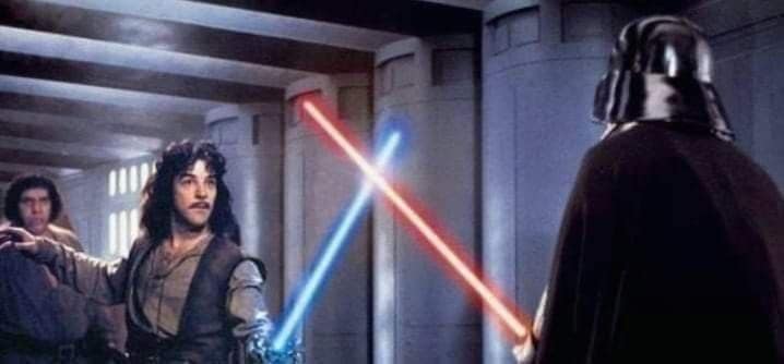 An absolute masterpiece classic meme seamlessly photopsops an iconic science fiction element directly into the cult-classic movie, The Princess Bride. The image shows Inigo Montoya holding a glowing blue Star Wars lightsaber, crossing blades with Darth Vader's red lightsaber in a castle corridor while a massive Fezzik watches anxiously from the background.