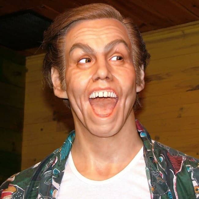 Bizarrely expressive wax figure meant to represent Jim Carrey in a Hawaiian shirt.