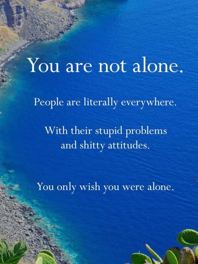 Introvert humor meme over blue ocean coastline you are not alone people are everywhere.
