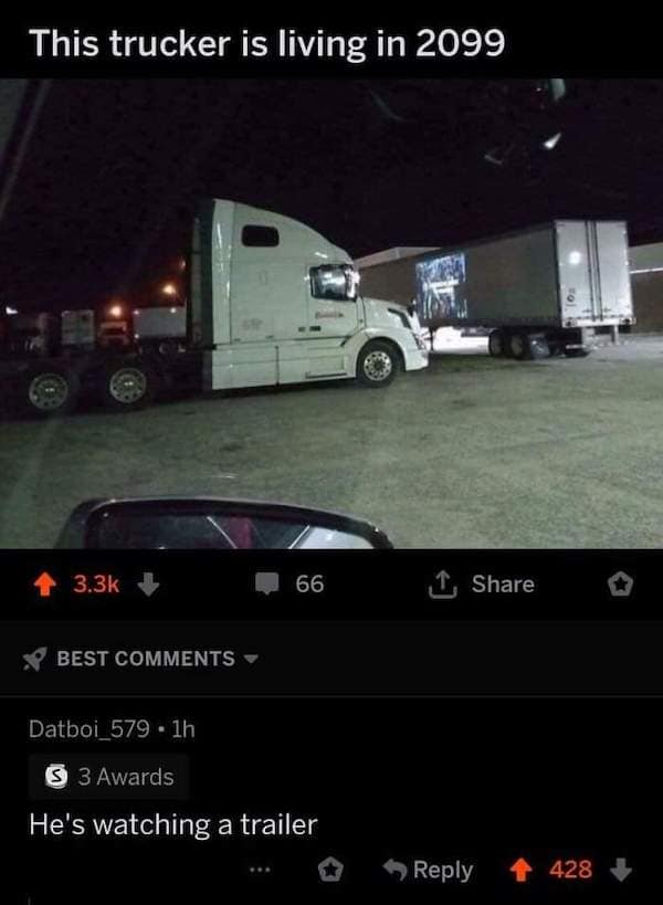 A clever double-entendre screenshot filed as a dumb meme shows a white semi-truck cab projecting a movie onto the side of a parked shipping container under the text "This trucker is living in 2099", backed by an award-winning comment from Datboi_579: "He's watching a trailer."