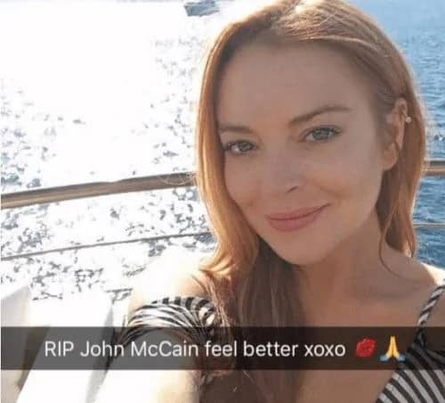 Lindsay Lohan smiling on a boat with a confusing Snapchat caption about John McCain.