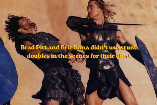 Achilles fighting Hector with swords in an intense battlefield duel without doubles.