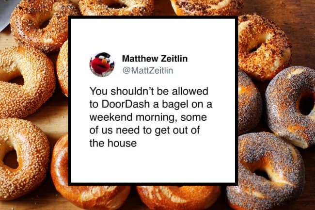 Food delivery meme showing a tweet over a background of toasted bagels, joking that people should not be allowed to DoorDash a bagel on a weekend morning because some of us need the forced errand just to experience sunlight, sidewalks, and society.