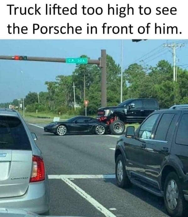Fender bender fail showing a lifted monster truck backed onto the hood of a low Porsche.
