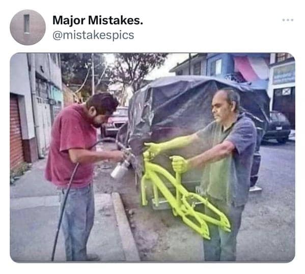 Major mistake social media photo of a man getting neon yellow spray paint on his bare arms.