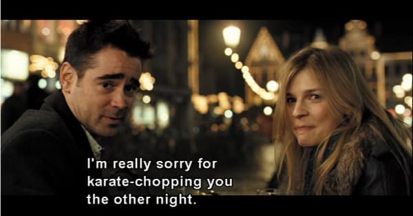 nighttime movie scene featuring a bizarrely funny In Bruges quote where Ray leans in during an outdoor date with Chloë to offer an incredibly awkward, deadpan apology for unexpectedly karate-chopping her a few nights prior.
