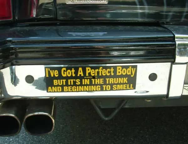 Shiny chrome car bumper with a dark joke about a perfect body in the trunk.