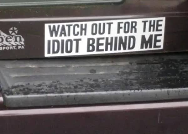 Simple bold text bumper sticker instructing drivers to watch out for idiots.