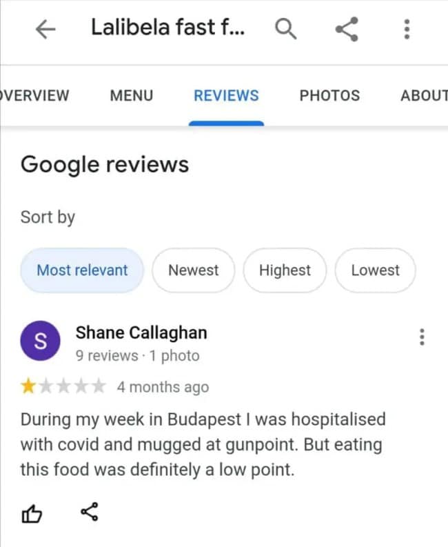 A grimly humorous tourist evaluation documented in a funny google review shows a 1-star rating where a traveler notes that despite being hospitalized with an illness and mugged at gunpoint during their vacation, eating this fast food was the definitive low point.