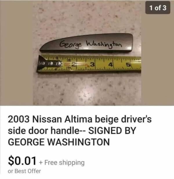 A grey plastic car door handle with George Washington written on it in marker.