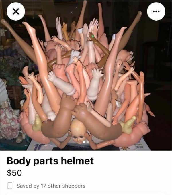 A terrifying helmet constructed entirely out of plastic doll arms and legs.
