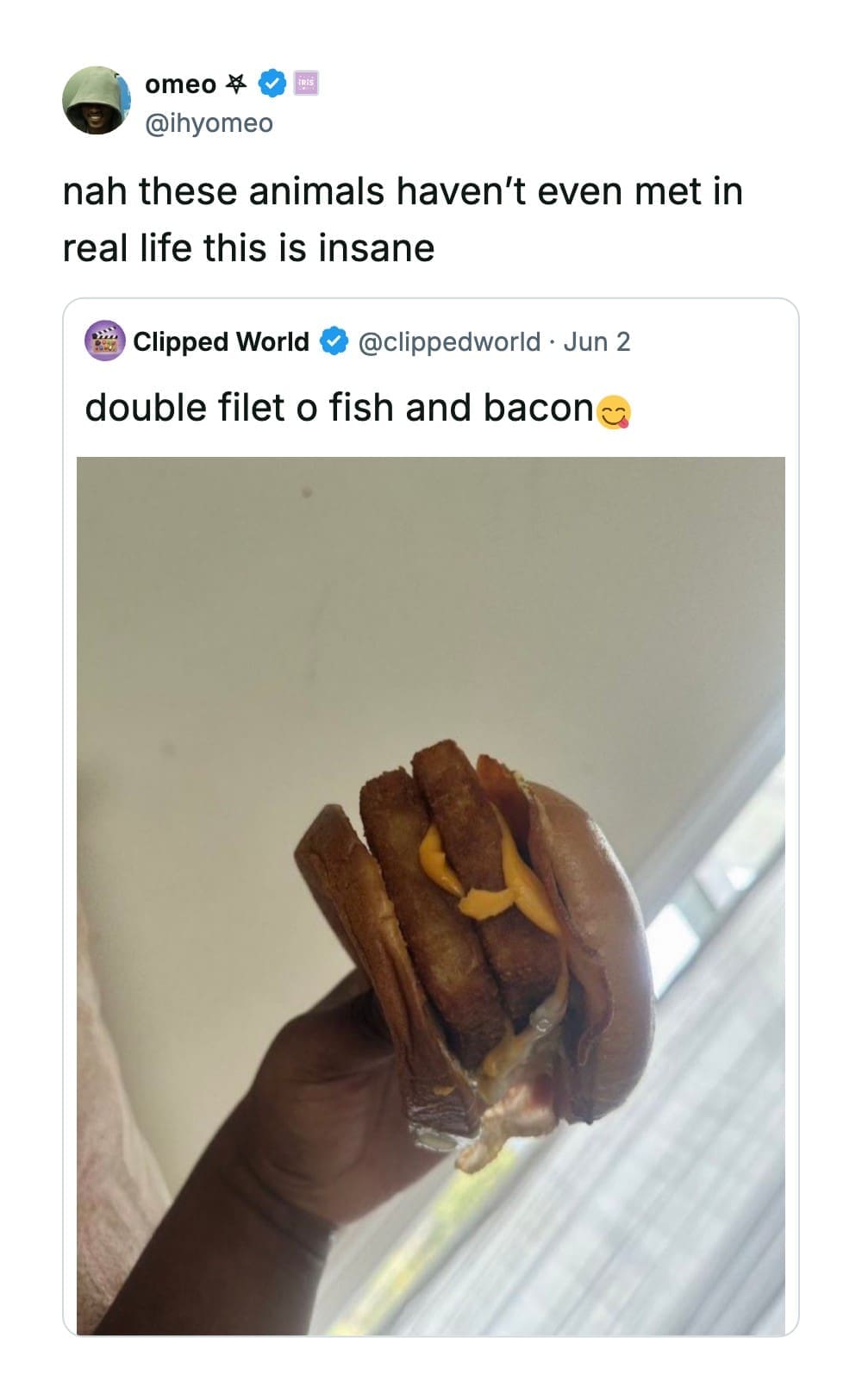 Close-up photograph of a custom fast-food hybrid sandwich combining a double fish fillet with strips of bacon inside a funny quote tweet by @ihyomeo.