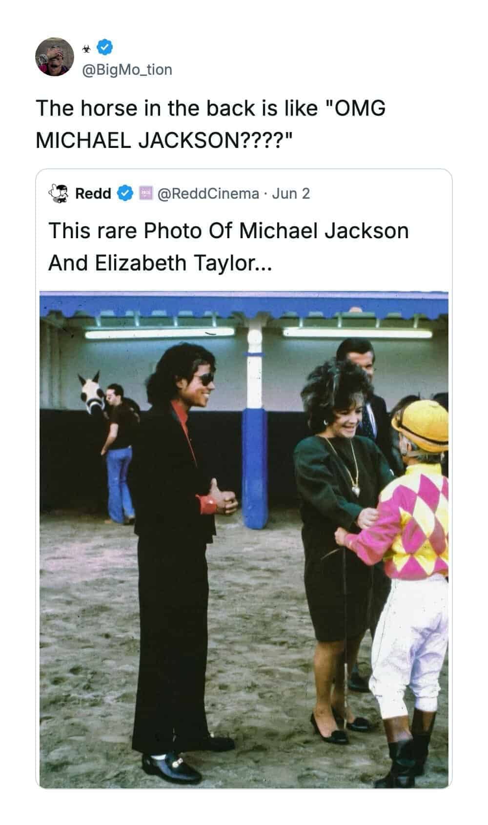 Stable photograph inside a funny quote tweet by @BigMo_tion showing a wide-eyed horse looking surprised in the background of a vintage photo featuring Michael Jackson, Elizabeth Taylor, and a jockey.