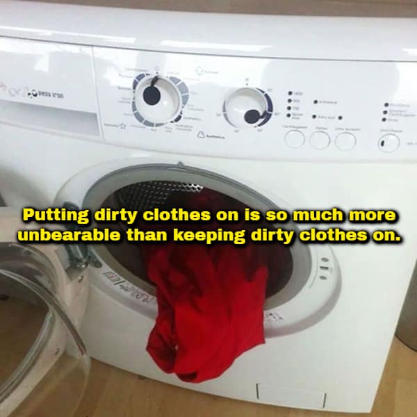 A funny shower thought photo featuring a piece of red clothing draping out of an open front-loading white washing machine, accompanied by the text: "Putting dirty clothes on is so much more unbearable than keeping dirty clothes on."