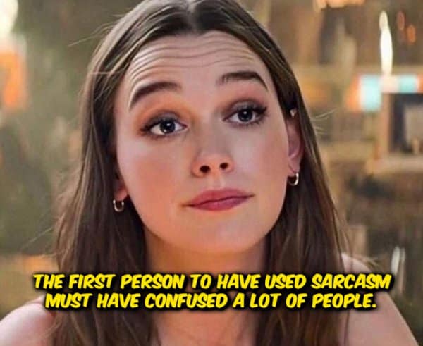 funny shower thought asset showing an image of actress Victoria Pedretti looking skeptical and thoughtful, captioned with yellow text: "The first person to have used sarcasm must have confused a lot of people."