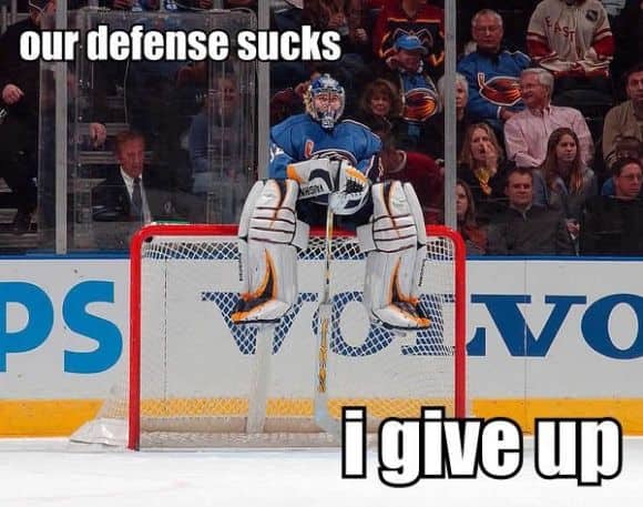 Humorous hockey meme showing a goalie sitting completely on top of the crossbar out of frustration.