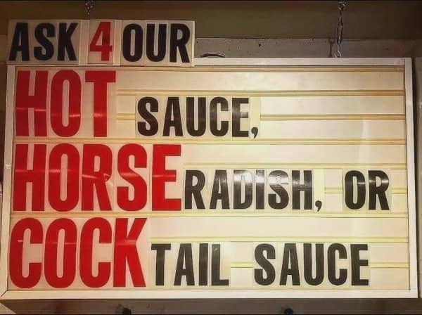 Unfortunate line layout on a restaurant menu board highlighting a vertical word.