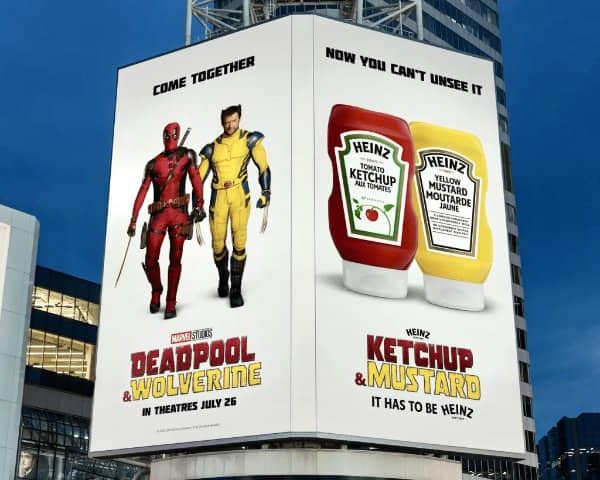 Dual sided billboard comparing Deadpool and Wolverine to ketchup and mustard bottles.