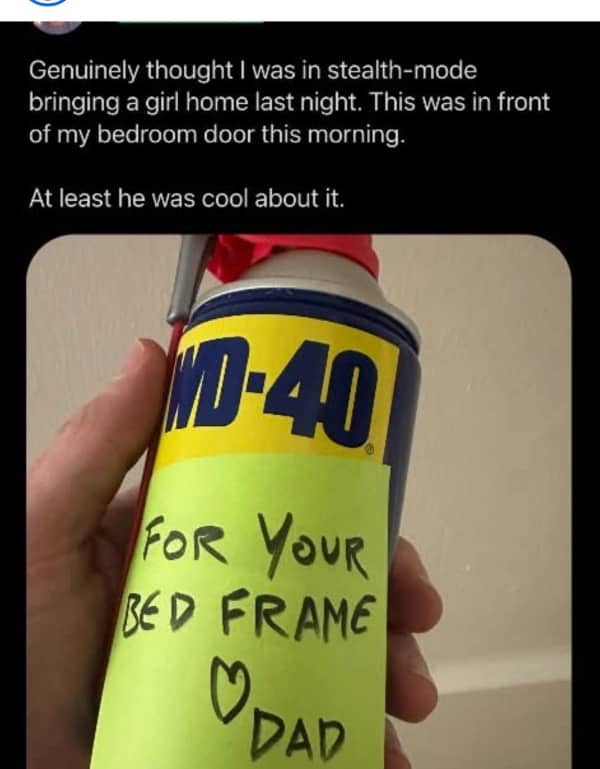 Hand holding a can of WD-40 with a sticky note from dad saying for your bed frame.