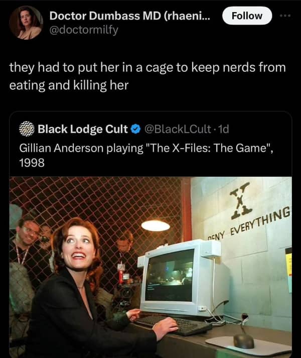 Gillian Anderson playing an X-Files computer game in 1998 behind a chain-link fence cage.