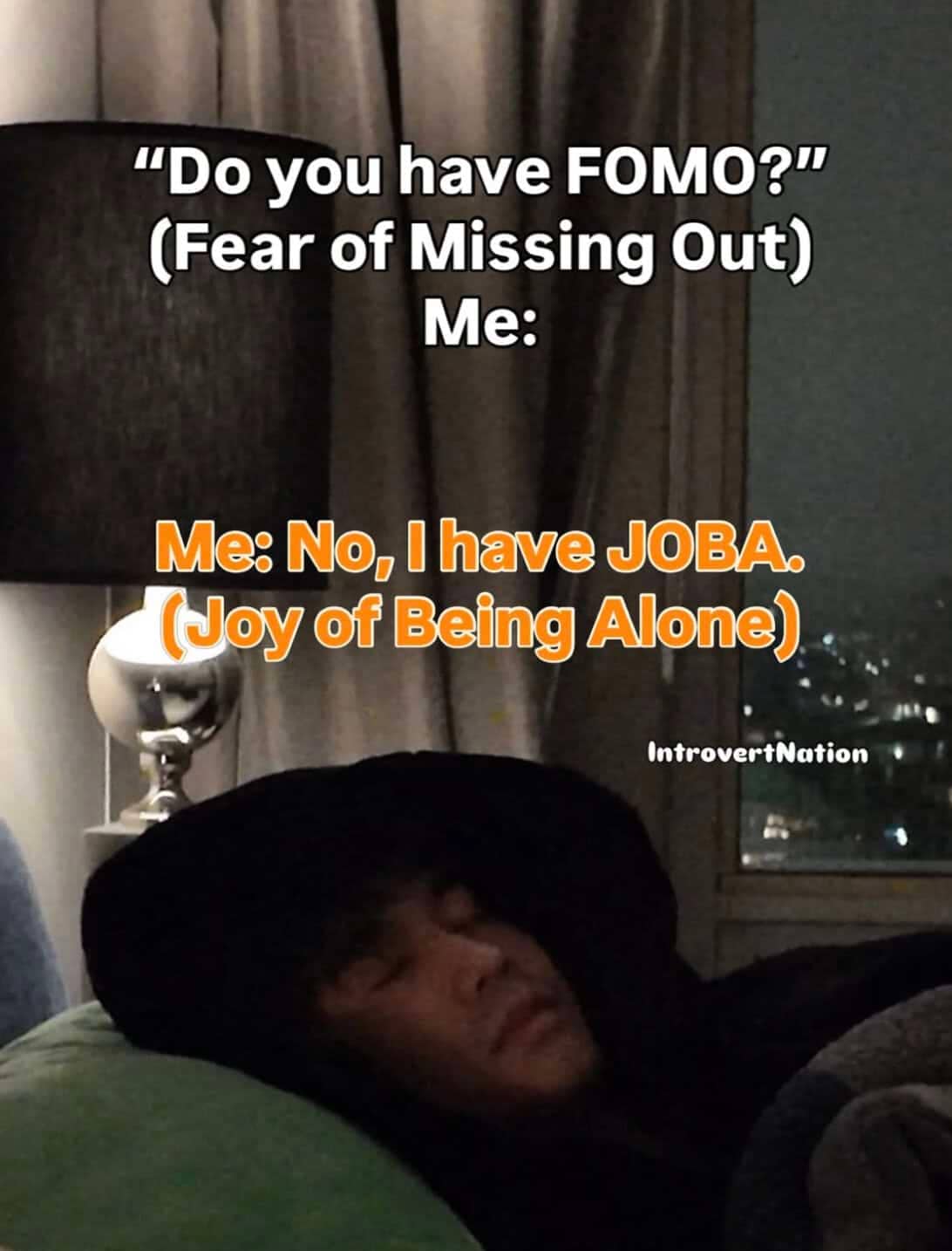 Text meme contrasting FOMO with JOBA, or Joy of Being Alone, featuring a person sleeping peacefully.