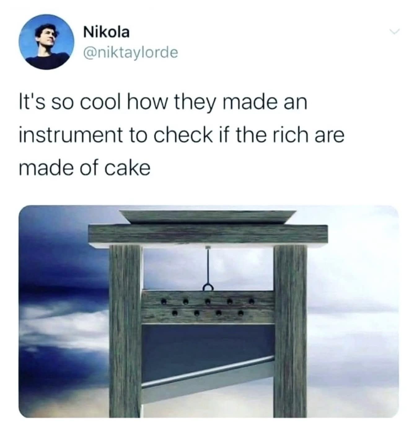 A dark-mode screenshot of a funny meme from user Nikola (@niktaylorde) detailing a political-themed joke, stating that it is cool how society invented an instrument (a 3D wood-grain rendering of a historic guillotine) to check if the ultra-wealthy are secretly made of cake.