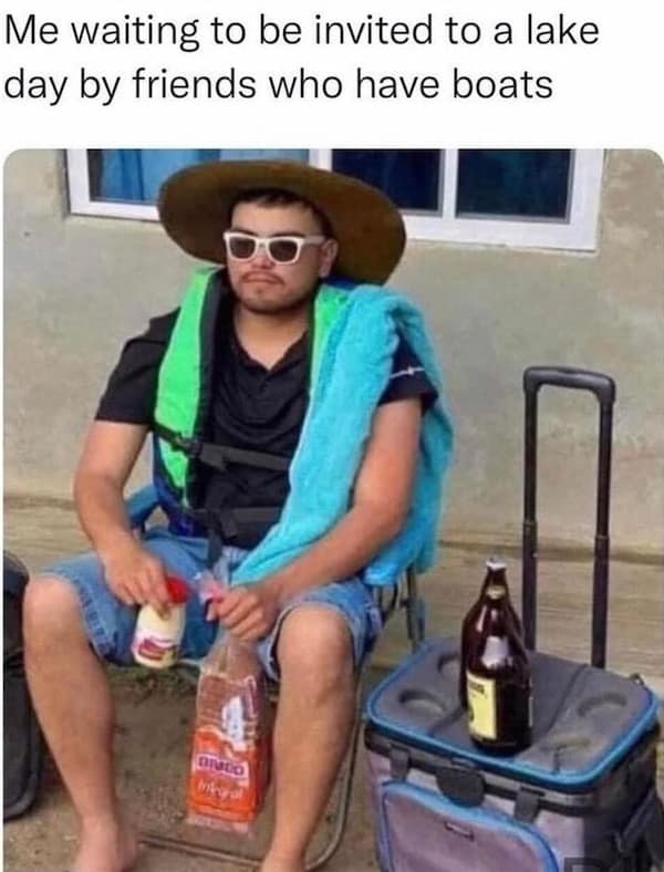 Man in a life jacket and straw hat sitting in a lawn chair next to a cooler and bread loaf in a meme dump photo.