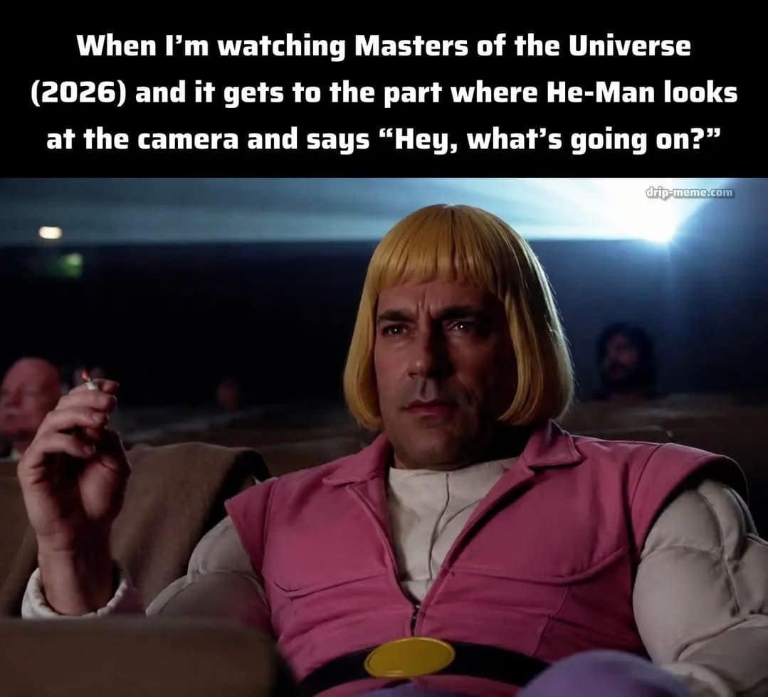 A pop-culture mashup from a meme dump depicts actor Jon Hamm as Don Draper dressed in He-Man's blonde bob and pink outfit in a theater, reacting to a fictionalized 2026 movie scene breaking the fourth wall to reference a famous viral song.