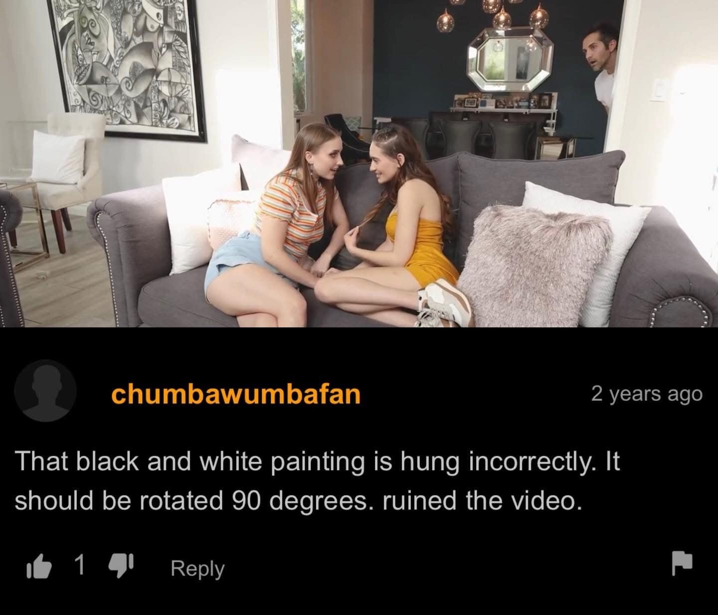 Adult media video screenshot with a funny comment from chumbawumbafan complaining about a misaligned abstract painting in a viral meme dump format.
