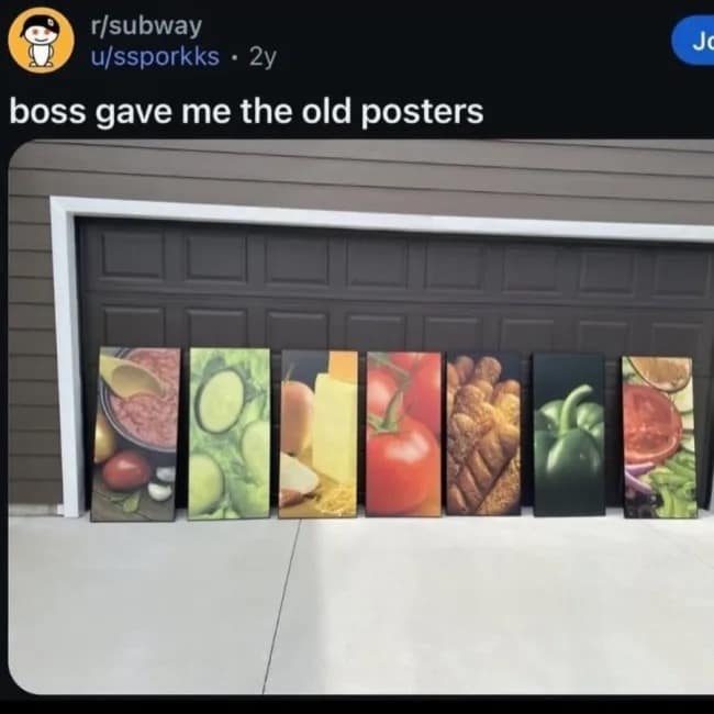A unique interior design choice captured in a meme dump displays seven large, vertical canvas Subway restaurant ingredient posters featuring close-ups of lettuce, tomatoes, and bread lined up against a closed garage door.