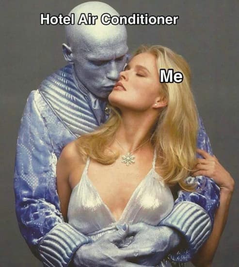 A funny meme featuring a movie promotional still of Arnold Schwarzenegger as the frozen villain Mr. Freeze intimately embracing a woman, labeled with text mapping Mr. Freeze as "Hotel Air Conditioner" and the woman as "Me".